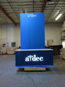 Custom 16 ft. High Gravitee Tower with Locking Storage, SEG Fabric Graphics, and Reception Counter with Backlit Programmable RGB Logo